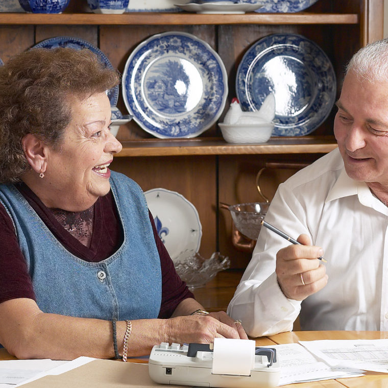 Seniors-paying-bills-scaled